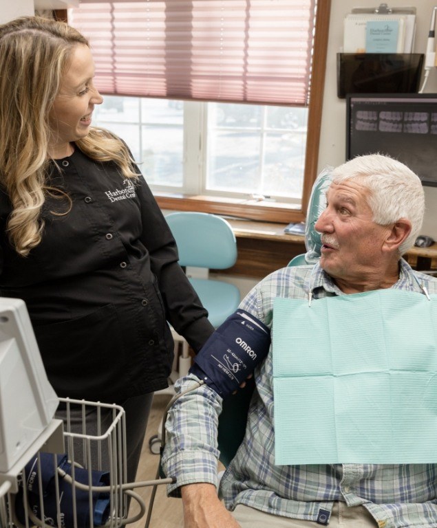 Dental patient getting their blood pressure taken