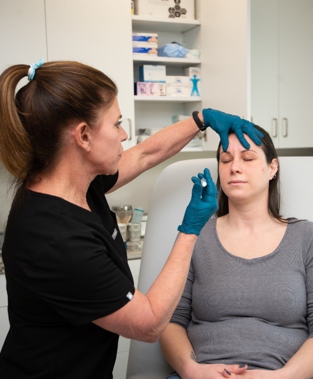 Dental patient receiving injection of Botox for T M J in Cambridge