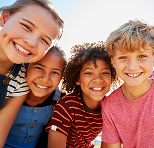 Close up of four children smiling