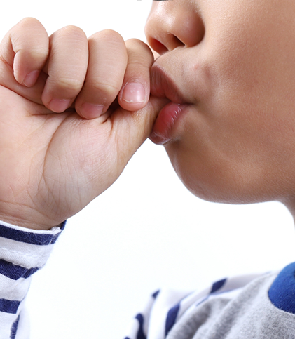 Close up of child sucking their thumb