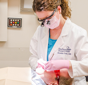 Female dentist treating a patient