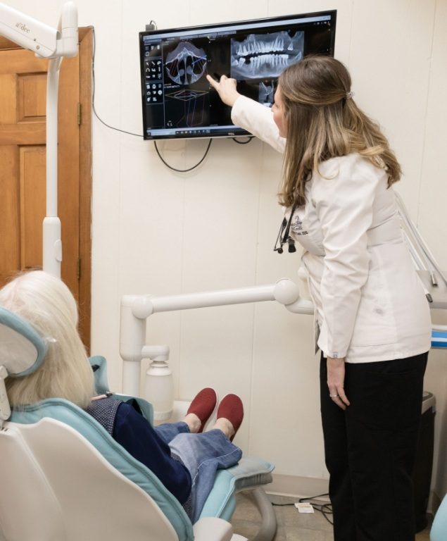 Cambridge dentist showing a patient digital x rays of their teeth