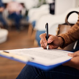 Patient filling out form in lobby