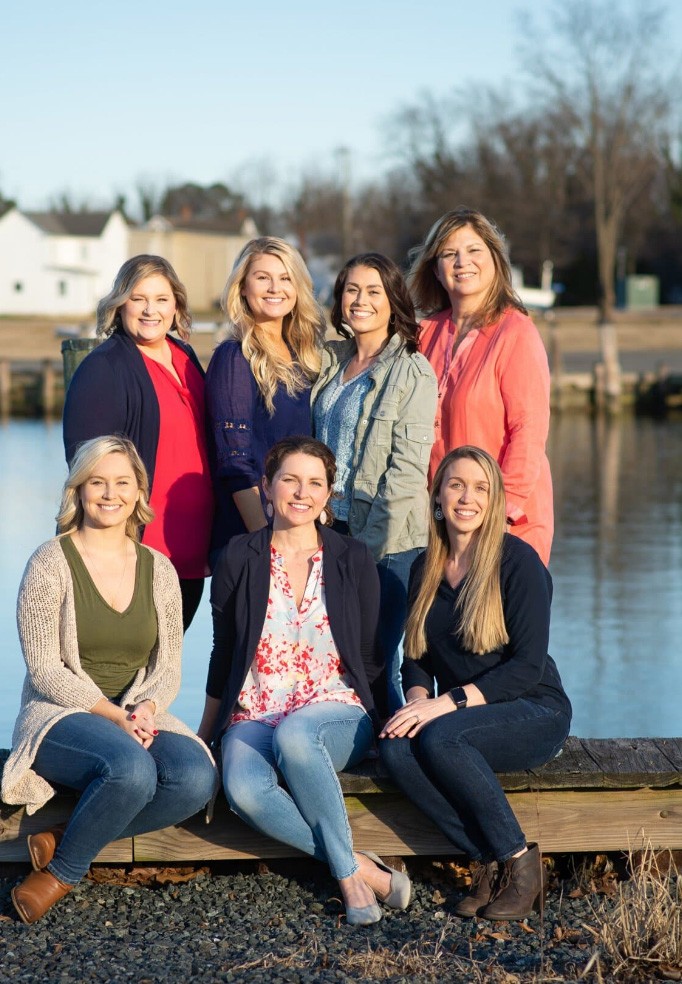 Smiling Harbor Dental Center team with pond in background