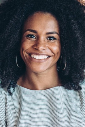 Smiling woman with silver hoop earrings