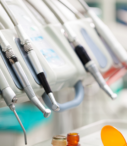 Close up of multiple dental instruments