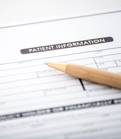 Pen lying on top of patient form