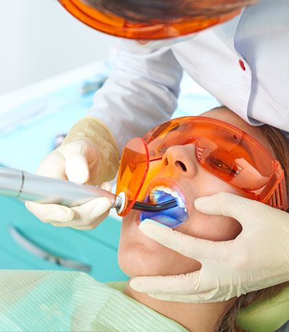 Close up of patient having cosmetic bonding performed