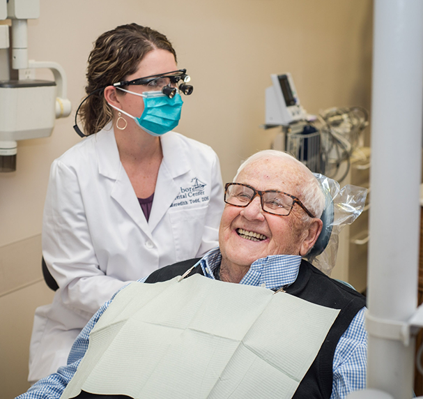 Dentist treating a male dental patient