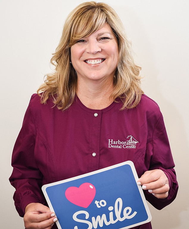 Lorraine holding sign that says heart to smile