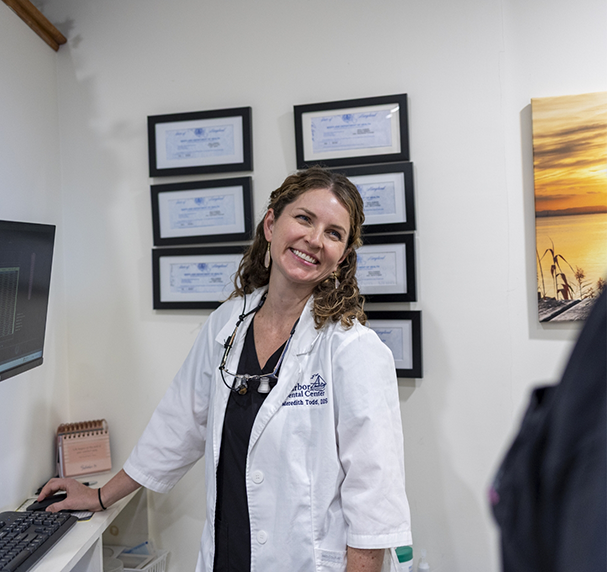 Female dentist smiling in dental office