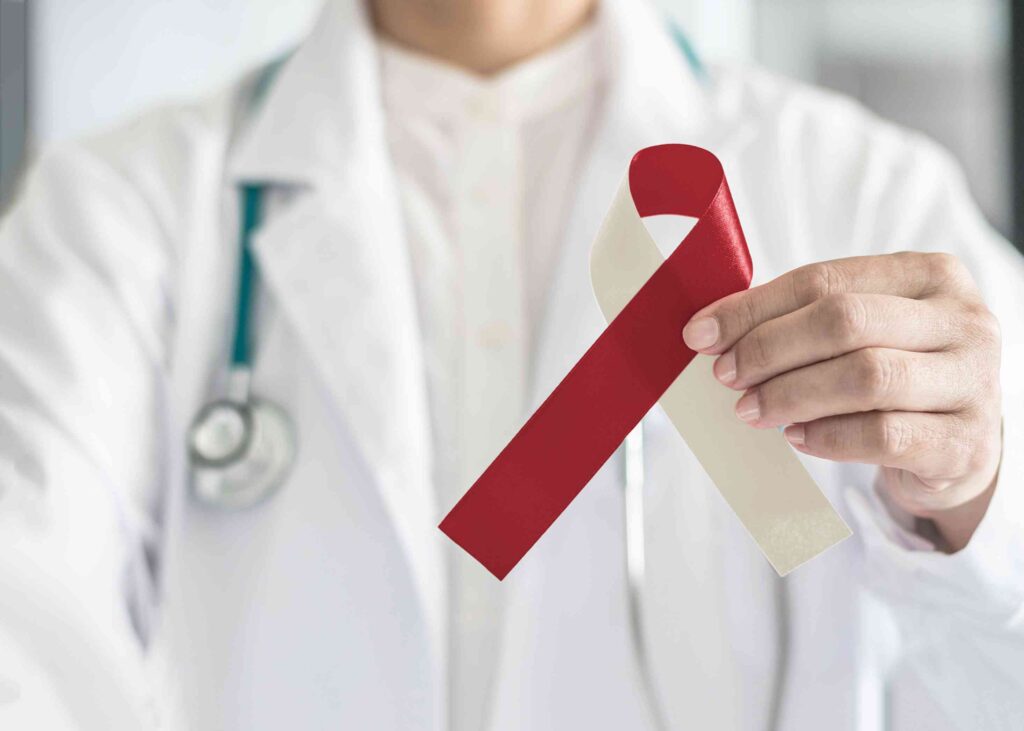 Man holding an oral cancer ribbon
