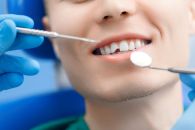 A man with a chipped tooth in a dental office